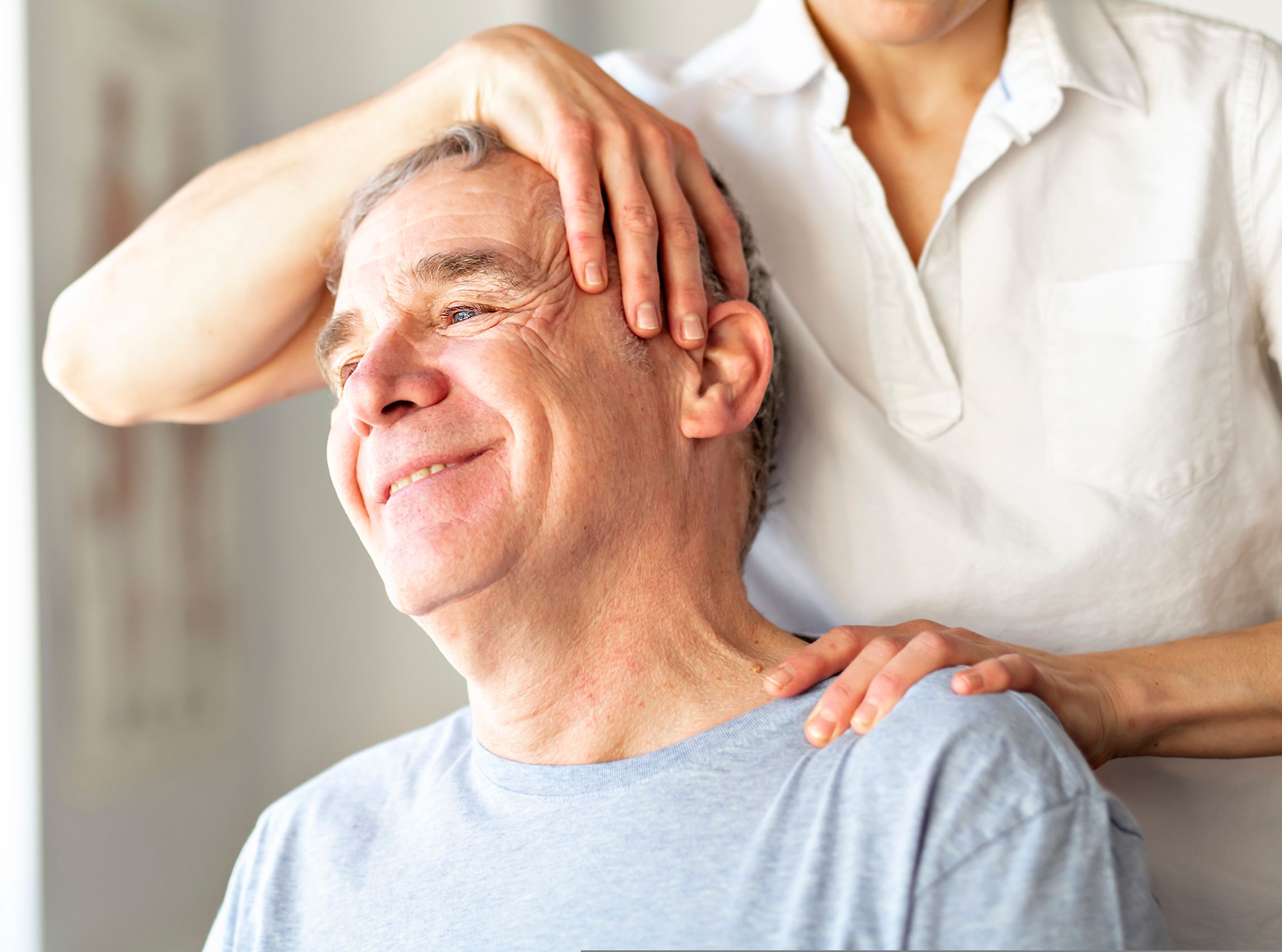 A Modern rehabilitation physiotherapy worker with senior client